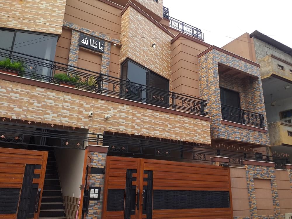 Construction of a 10 Marla duplex house by Kamboh Enterprises.