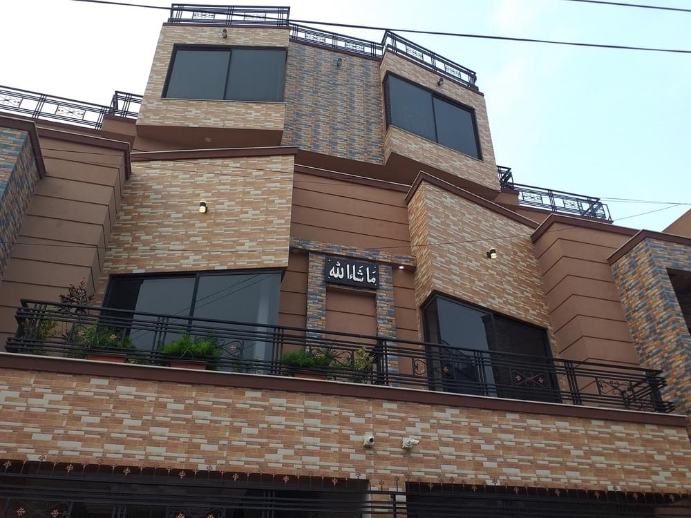 Construction of a 10 Marla duplex house by Kamboh Enterprises.