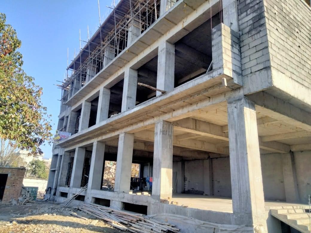 Construction of a commercial plaza by Kamboh Enterprises.