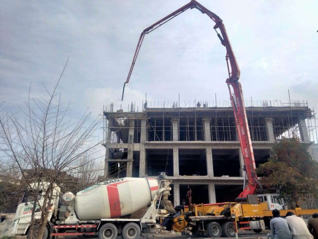 Construction of a commercial plaza by Kamboh Enterprises.