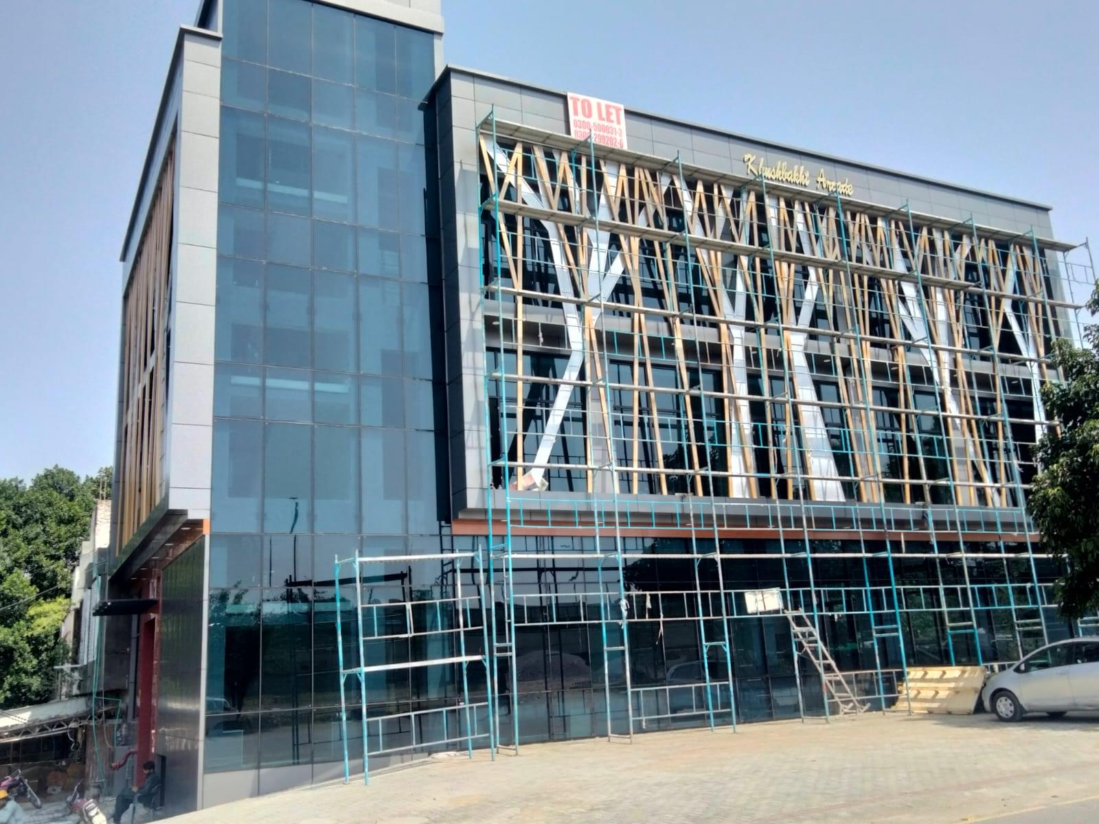 Construction of a commercial plaza by Kamboh Enterprises.